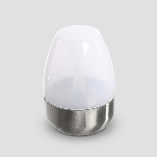 Havenlia solar warm glow garden candle lamp glowing on pathway at dusk