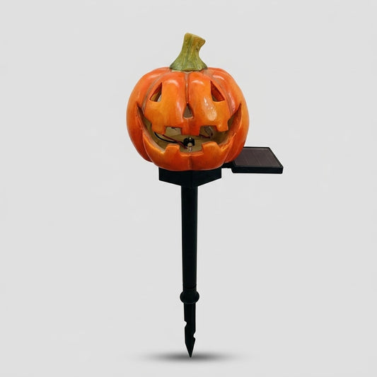 Havenlia solar Halloween pumpkin garden stake light glowing on garden path