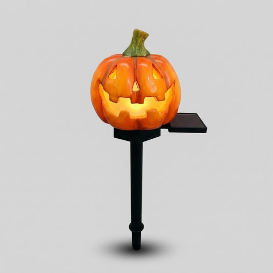 Havenlia solar Halloween pumpkin garden stake light glowing on garden path