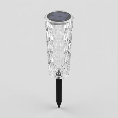 Havenlia solar rose garden stake light glowing in flower bed at dusk
