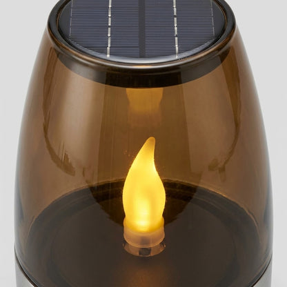 Havenlia solar warm glow garden candle lamp glowing on pathway at dusk