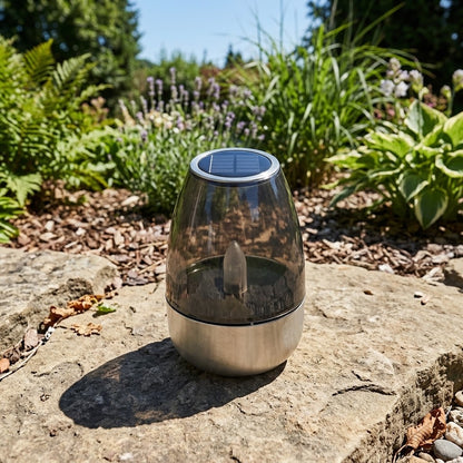 Havenlia solar warm glow garden candle lamp glowing on pathway at dusk