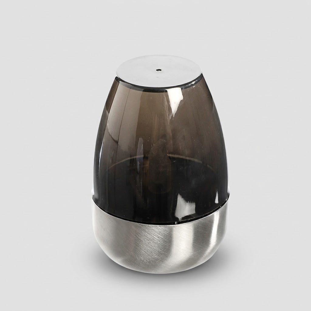 Havenlia solar warm glow garden candle lamp glowing on pathway at dusk