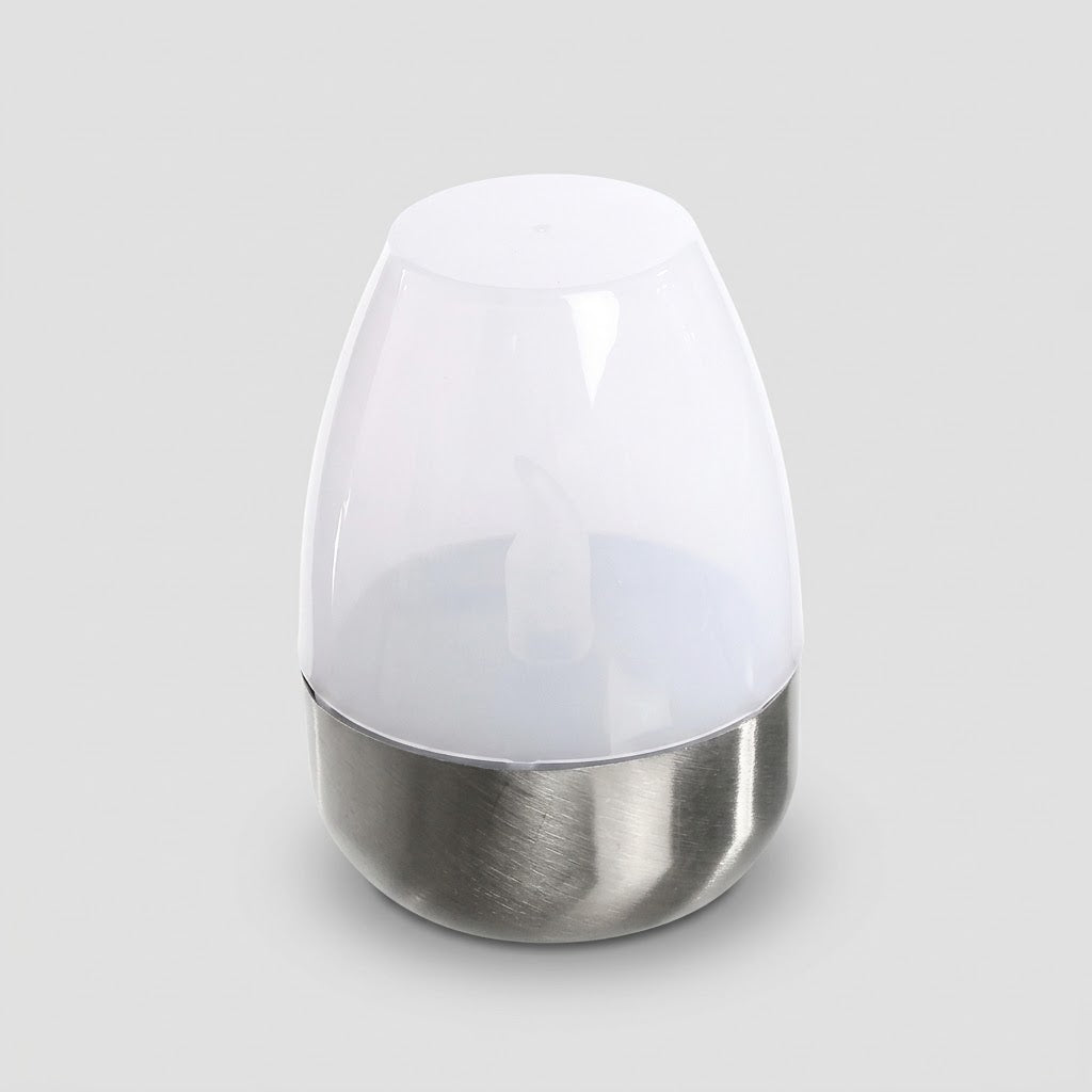 Havenlia solar warm glow garden candle lamp glowing on pathway at dusk