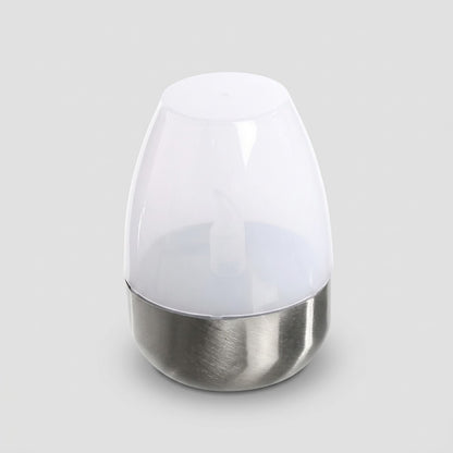 Havenlia solar warm glow garden candle lamp glowing on pathway at dusk