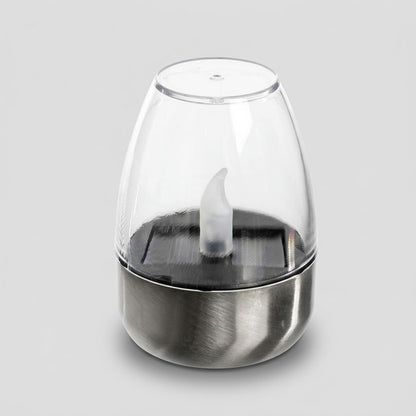 Havenlia solar warm glow garden candle lamp glowing on pathway at dusk